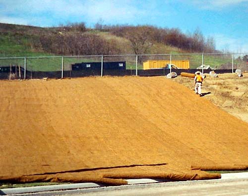 workers applying jute mesh